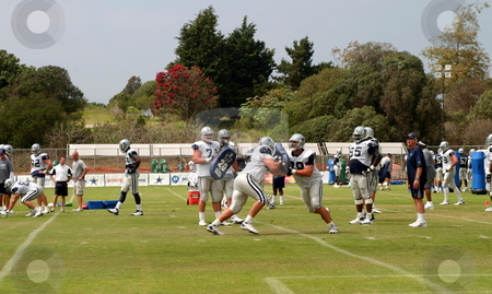 To use this stock image in your creative project, please select the size you need over to the right and click the "Add to Cart" button.
Your downloaded image will come with the Cutcaster watermark removed so don’t worry about the watermark you see on this page. Dallas Cowboys Training stock photo, The Dallas Cowboys at their 2008 summer training camp in Oxnard, CA during a training session working out. by Henrik Lehnerer