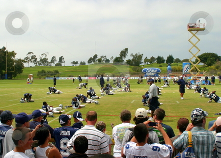 To use this stock image in your creative project, please select the size you need over to the right and click the "Add to Cart" button.
Your downloaded image will come with the Cutcaster watermark removed so don’t worry about the watermark you see on this page. Dallas Cowboys Training stock photo, The Dallas Cowboys at their 2008 summer training camp in Oxnard, CA during a training session working out. by Henrik Lehnerer
