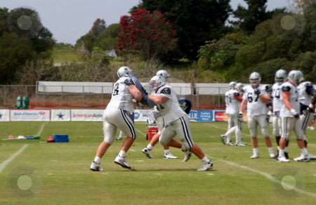 To use this stock image in your creative project, please select the size you need over to the right and click the "Add to Cart" button.
Your downloaded image will come with the Cutcaster watermark removed so don’t worry about the watermark you see on this page. Dallas Cowboys Training stock photo, The Dallas Cowboys at their 2008 summer training camp in Oxnard, CA during a training session working out. by Henrik Lehnerer