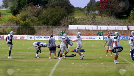 To use this stock image in your creative project, please select the size you need over to the right and click the "Add to Cart" button.
Your downloaded image will come with the Cutcaster watermark removed so don’t worry about the watermark you see on this page. Dallas Cowboys Training stock photo, The Dallas Cowboys at their 2008 summer training camp in Oxnard, CA during a training session working out. by Henrik Lehnerer
