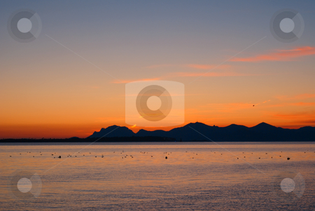 To use this stock image in your creative project, please select the size you need over to the right and click the "Add to Cart" button.
Your downloaded image will come with the Cutcaster watermark removed so don’t worry about the watermark you see on this page. Sunset in French Riviera stock photo, Winter Sunrise in French Riviera (South-East of France). View from the City of Cannes. by Serge VILLA