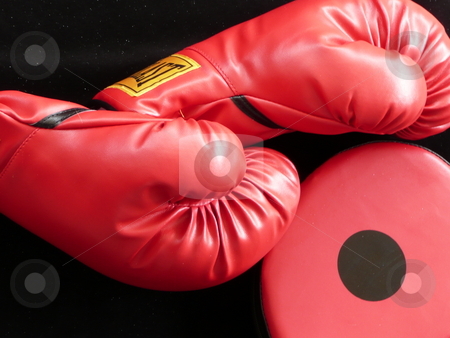 To use this stock image in your creative project, please select the size you need over to the right and click the "Add to Cart" button.
Your downloaded image will come with the Cutcaster watermark removed so don’t worry about the watermark you see on this page. Boxing gloves stock photo, Boxing gloves with a punching mitt. by Corinna Walby