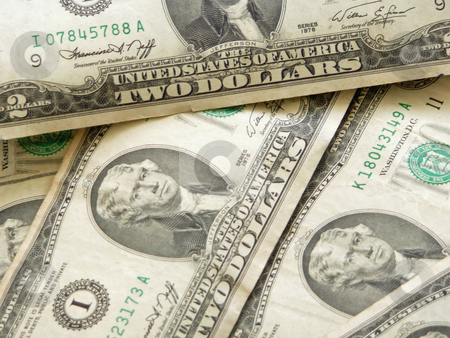 To use this stock image in your creative project, please select the size you need over to the right and click the "Add to Cart" button.
Your downloaded image will come with the Cutcaster watermark removed so don’t worry about the watermark you see on this page. Two Dollar Bills stock photo, by Corinna Walby