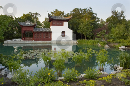 To use this stock image in your creative project, please select the size you need over to the right and click the "Add to Cart" button.
Your downloaded image will come with the Cutcaster watermark removed so don’t worry about the watermark you see on this page. Garden stock photo, Chinease pavilion in botanical garden of Montreal, Quebec Canada by Vlad Podkhlebnik