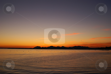 To use this stock image in your creative project, please select the size you need over to the right and click the "Add to Cart" button.
Your downloaded image will come with the Cutcaster watermark removed so don’t worry about the watermark you see on this page. Sunset stock photo, Sunset over the Esterel mountain in winter. Location French Riviera by Serge VILLA