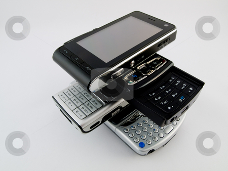To use this stock image in your creative project, please select the size you need over to the right and click the "Add to Cart" button.
Your downloaded image will come with the Cutcaster watermark removed so don’t worry about the watermark you see on this page. Stack Pile of Several Modern Mobile Phones PDA Cell Handheld Uni stock photo, Stack Pile of Several Modern Mobile Phones PDA Cell Handheld Units Isolated on White Background by Robert Davies