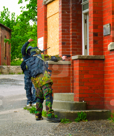 To use this stock image in your creative project, please select the size you need over to the right and click the "Add to Cart" button.
Your downloaded image will come with the Cutcaster watermark removed so don’t worry about the watermark you see on this page. Men with Guns Attacking Doorway stock photo, Military Airsoft Event by Robert Davies