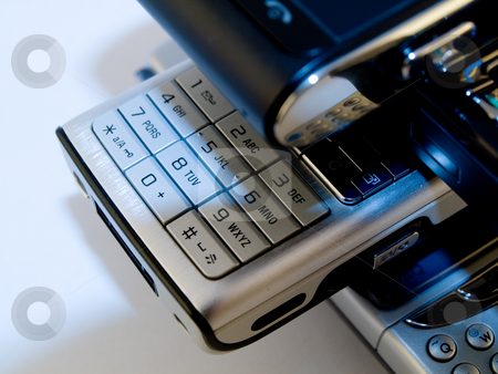 To use this stock image in your creative project, please select the size you need over to the right and click the "Add to Cart" button.
Your downloaded image will come with the Cutcaster watermark removed so don’t worry about the watermark you see on this page. Stack Pile of Several Modern Mobile Phones PDA Cell Handheld Uni stock photo, Stack Pile of Several Modern Mobile Phones PDA Cell Handheld Units Isolated on White Background by Robert Davies