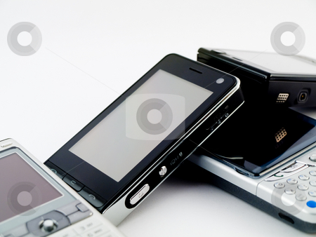 To use this stock image in your creative project, please select the size you need over to the right and click the "Add to Cart" button.
Your downloaded image will come with the Cutcaster watermark removed so don’t worry about the watermark you see on this page. Stack Pile of Several Modern Mobile Phones PDA Cell Handheld Uni stock photo, Stack Pile of Several Modern Mobile Phones PDA Cell Handheld Units Isolated on White Background by Robert Davies