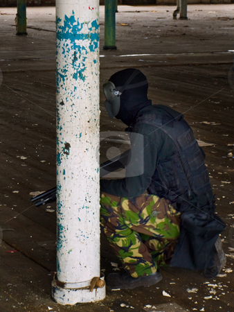 To use this stock image in your creative project, please select the size you need over to the right and click the "Add to Cart" button.
Your downloaded image will come with the Cutcaster watermark removed so don’t worry about the watermark you see on this page. Man with Gun in Camouflage Crouching stock photo, Military Airsoft Event by Robert Davies