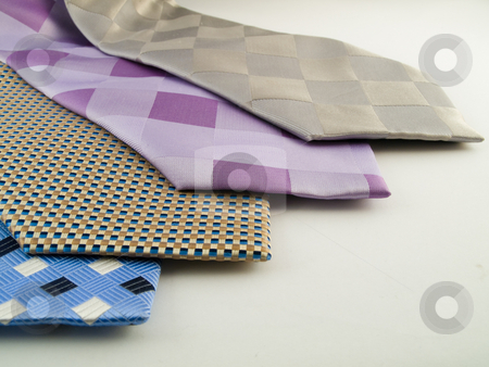 To use this stock image in your creative project, please select the size you need over to the right and click the "Add to Cart" button.
Your downloaded image will come with the Cutcaster watermark removed so don’t worry about the watermark you see on this page. Close Up Neck Ties Showing Pattern stock photo, Close Up Neck Ties Showing Silk Pattern on Rich Cloth by Robert Davies