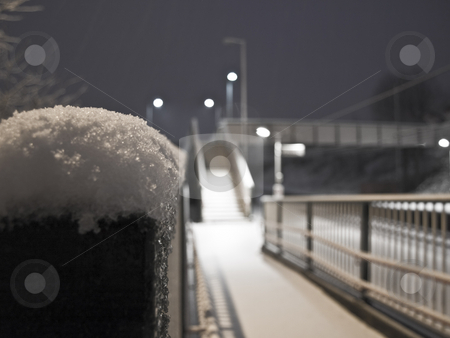 To use this stock image in your creative project, please select the size you need over to the right and click the "Add to Cart" button.
Your downloaded image will come with the Cutcaster watermark removed so don’t worry about the watermark you see on this page. Fence With Snow on Top Near Railings stock photo, Fence With Snow on Top Near Railings and Stairway on Railway Station by Robert Davies