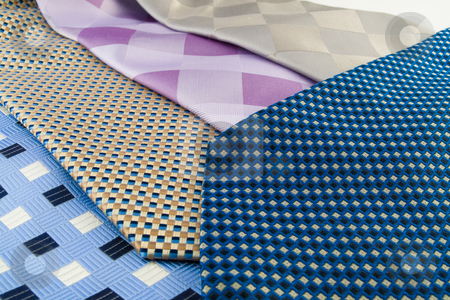 To use this stock image in your creative project, please select the size you need over to the right and click the "Add to Cart" button.
Your downloaded image will come with the Cutcaster watermark removed so don’t worry about the watermark you see on this page. Close Up Neck Ties Showing Pattern stock photo, Close Up Neck Ties Showing Silk Pattern on Rich Cloth by Robert Davies