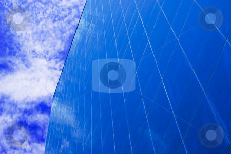 To use this stock image in your creative project, please select the size you need over to the right and click the "Add to Cart" button.
Your downloaded image will come with the Cutcaster watermark removed so don’t worry about the watermark you see on this page. Blue on Blue Building stock photo, Perspective on a blue Corporate office building with sky reflecting on windows by Robert Cabrera