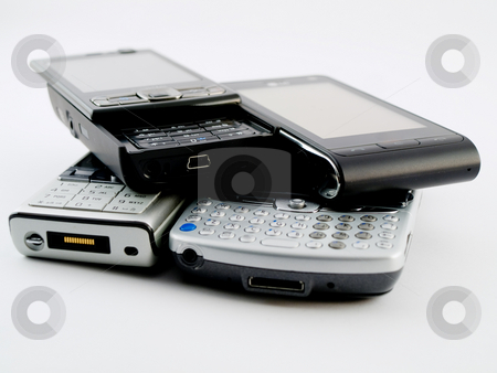 To use this stock image in your creative project, please select the size you need over to the right and click the "Add to Cart" button.
Your downloaded image will come with the Cutcaster watermark removed so don’t worry about the watermark you see on this page. Stack Pile of Several Modern Mobile Phones PDA Cell Handheld Uni stock photo, Stack Pile of Several Modern Mobile Phones PDA Cell Handheld Units Isolated on White Background by Robert Davies
