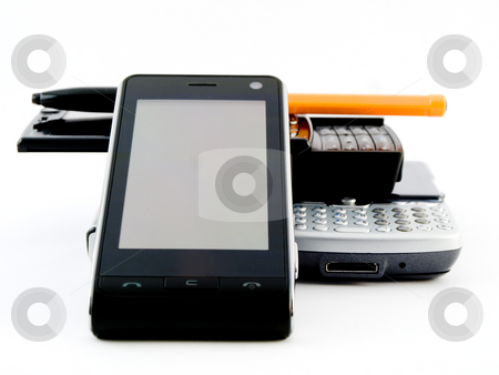 To use this stock image in your creative project, please select the size you need over to the right and click the "Add to Cart" button.
Your downloaded image will come with the Cutcaster watermark removed so don’t worry about the watermark you see on this page. Stack Pile of Several Modern Mobile Phones PDA Cell Handheld Uni stock photo, Stack Pile of Several Modern Mobile Phones PDA Cell Handheld Units with Biro Ballpoint Isolated on White Background by Robert Davies