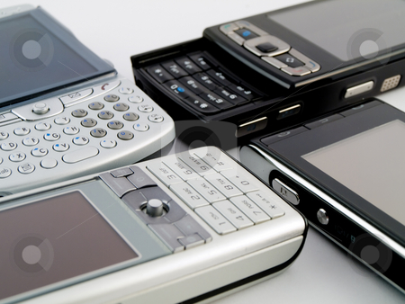 To use this stock image in your creative project, please select the size you need over to the right and click the "Add to Cart" button.
Your downloaded image will come with the Cutcaster watermark removed so don’t worry about the watermark you see on this page. Stack Pile of Several Modern Mobile Phones PDA Cell Handheld Uni stock photo, Stack Pile of Several Modern Mobile Phones PDA Cell Handheld Units Isolated on White Background by Robert Davies