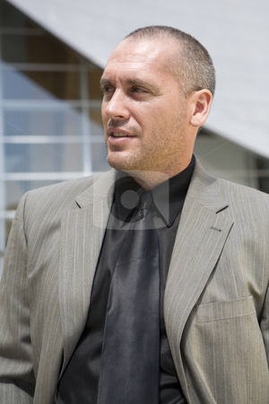 To use this stock image in your creative project, please select the size you need over to the right and click the "Add to Cart" button.
Your downloaded image will come with the Cutcaster watermark removed so don’t worry about the watermark you see on this page. Business Man Series stock photo, Fashion model posing as business man in front of high tech building by Csaba Fikker
