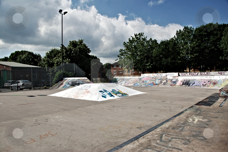 To use this stock image in your creative project, please select the size you need over to the right and click the "Add to Cart" button.
Your downloaded image will come with the Cutcaster watermark removed so don’t worry about the watermark you see on this page. Skate Park Ramps stock photo, A photograph of a skate boarding park with ramps and graffiti by Philippa Willitts