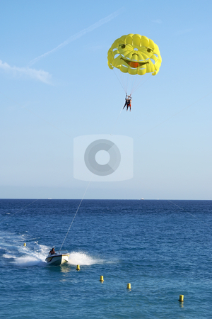 To use this stock image in your creative project, please select the size you need over to the right and click the "Add to Cart" button.
Your downloaded image will come with the Cutcaster watermark removed so don’t worry about the watermark you see on this page. Parachute stock photo, Motor boat and parachute. Beach sport by Serge VILLA