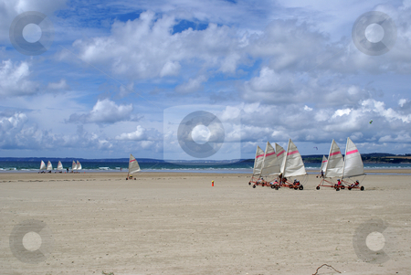 To use this stock image in your creative project, please select the size you need over to the right and click the "Add to Cart" button.
Your downloaded image will come with the Cutcaster watermark removed so don’t worry about the watermark you see on this page. Windcar stock photo, A windcar race on a Brittany beach by Serge VILLA