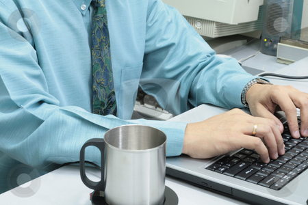 To use this stock image in your creative project, please select the size you need over to the right and click the "Add to Cart" button.
Your downloaded image will come with the Cutcaster watermark removed so don’t worry about the watermark you see on this page. Working executive stock photo, Male executive working on a laptop with tin cup on the side by Jonas Marcos San Luis