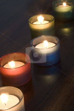 To use this stock image in your creative project, please select the size you need over to the right and click the "Add to Cart" button.
Your downloaded image will come with the Cutcaster watermark removed so don’t worry about the watermark you see on this page. Tealights stock photo, A set of 5 tea light candles by Stephen Gibson