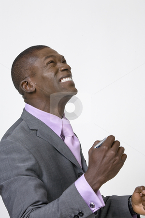 To use this stock image in your creative project, please select the size you need over to the right and click the "Add to Cart" button.
Your downloaded image will come with the Cutcaster watermark removed so don’t worry about the watermark you see on this page. African American Professional celebrating stock photo, Black Businessman celebrating and looking to the heavans by Csaba Fikker