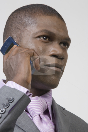 To use this stock image in your creative project, please select the size you need over to the right and click the "Add to Cart" button.
Your downloaded image will come with the Cutcaster watermark removed so don’t worry about the watermark you see on this page. Black Businessman listening to phone stock photo, Black Businessman listening to his phone by Csaba Fikker