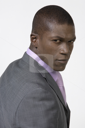 To use this stock image in your creative project, please select the size you need over to the right and click the "Add to Cart" button.
Your downloaded image will come with the Cutcaster watermark removed so don’t worry about the watermark you see on this page. Black Businessman stock photo, Black Business man looking over his shoulder by Csaba Fikker