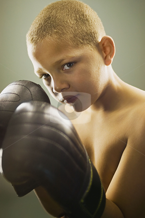 To use this stock image in your creative project, please select the size you need over to the right and click the "Add to Cart" button.
Your downloaded image will come with the Cutcaster watermark removed so don’t worry about the watermark you see on this page. MPIXIS900788 stock photo, Boy wearing boxing gloves by Mpixis World