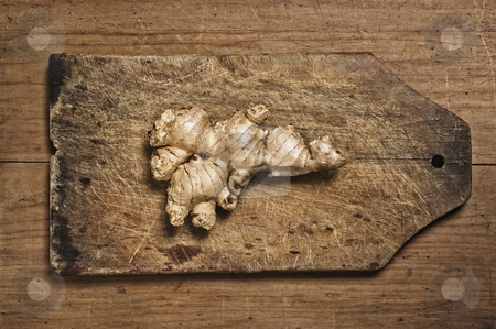 To use this stock image in your creative project, please select the size you need over to the right and click the "Add to Cart" button.
Your downloaded image will come with the Cutcaster watermark removed so don’t worry about the watermark you see on this page. Ginger stock photo, Ginger rhizome on a wooden cutting table. by Pablo Caridad