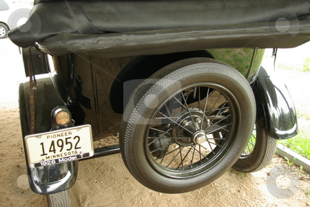To use this stock image in your creative project, please select the size you need over to the right and click the "Add to Cart" button.
Your downloaded image will come with the Cutcaster watermark removed so don’t worry about the watermark you see on this page. Model T Ford stock photo, Rear end view of a restored 1926 Model T Ford (Tin Lizzie). by Dennis Thomsen