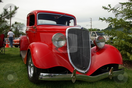 To use this stock image in your creative project, please select the size you need over to the right and click the "Add to Cart" button.
Your downloaded image will come with the Cutcaster watermark removed so don’t worry about the watermark you see on this page. Red 1934 Ford Coupe stock photo, Images of this 1934 Ford coupe show how a vintage car can be restored and brought back to life with skill, hard work, and money. The antique auto was displayed at the Pequot Lakes, Minnesota Car Show on June 7, 2008. by Dennis Thomsen