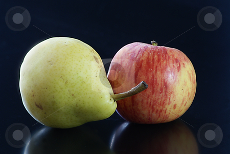 To use this stock image in your creative project, please select the size you need over to the right and click the "Add to Cart" button.
Your downloaded image will come with the Cutcaster watermark removed so don’t worry about the watermark you see on this page. Pear and Apple love stock photo, Close up of a red and yellow apple with a green pear on a black background by Serge VILLA