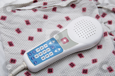 To use this stock image in your creative project, please select the size you need over to the right and click the "Add to Cart" button.
Your downloaded image will come with the Cutcaster watermark removed so don’t worry about the watermark you see on this page. Nurse Call Remote Control stock photo, A TV remote control with a nurse call button. by Robert Byron