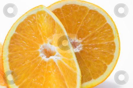 To use this stock image in your creative project, please select the size you need over to the right and click the "Add to Cart" button.
Your downloaded image will come with the Cutcaster watermark removed so don’t worry about the watermark you see on this page. Sliced Orange stock photo, Cross sections of fresh and juicy oranges. by Robert Byron