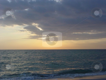 To use this stock image in your creative project, please select the size you need over to the right and click the "Add to Cart" button.
Your downloaded image will come with the Cutcaster watermark removed so don’t worry about the watermark you see on this page. Sunset Beach stock photo, by Lori Kirk