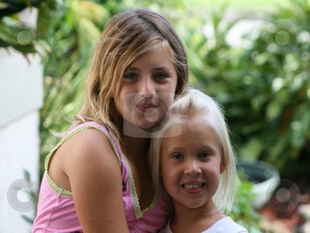 To use this stock image in your creative project, please select the size you need over to the right and click the "Add to Cart" button.
Your downloaded image will come with the Cutcaster watermark removed so don’t worry about the watermark you see on this page. Young girls posing stock photo, Two blonde haired young girls holding one another by Lori Kirk