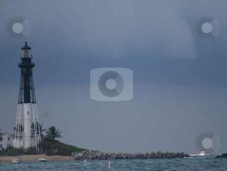 To use this stock image in your creative project, please select the size you need over to the right and click the "Add to Cart" button.
Your downloaded image will come with the Cutcaster watermark removed so don’t worry about the watermark you see on this page. Lighthouse storm stock photo, Lighthouse in the distance as a storm rolls in by Lori Kirk