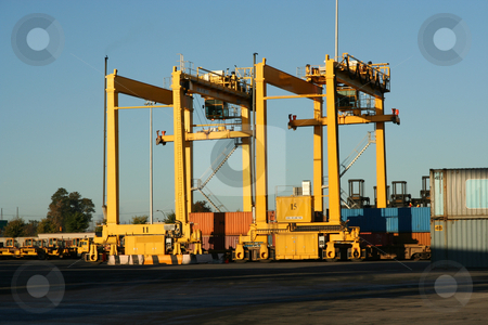 To use this stock image in your creative project, please select the size you need over to the right and click the "Add to Cart" button.
Your downloaded image will come with the Cutcaster watermark removed so don’t worry about the watermark you see on this page. Series of container cranes stock photo, Containers and container cranes in a major port by Claude Beaubien