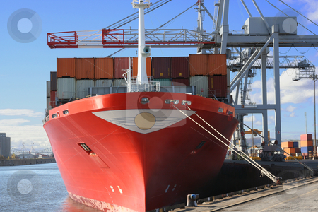 To use this stock image in your creative project, please select the size you need over to the right and click the "Add to Cart" button.
Your downloaded image will come with the Cutcaster watermark removed so don’t worry about the watermark you see on this page. Container ship being unloaded stock photo, Container ship being unloaded in a major port by Claude Beaubien
