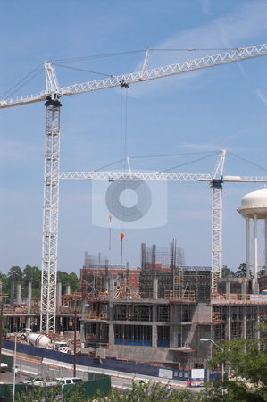 To use this stock image in your creative project, please select the size you need over to the right and click the "Add to Cart" button.
Your downloaded image will come with the Cutcaster watermark removed so don’t worry about the watermark you see on this page. Construction Site stock photo, A construction site with large industrial cranes. by Robert Byron