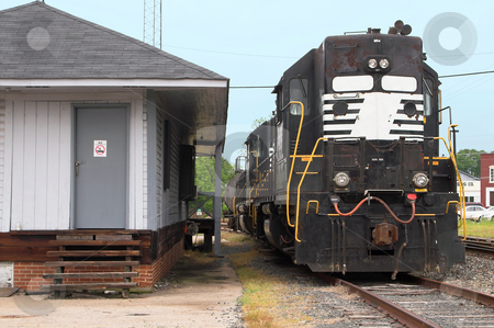 To use this stock image in your creative project, please select the size you need over to the right and click the "Add to Cart" button.
Your downloaded image will come with the Cutcaster watermark removed so don’t worry about the watermark you see on this page. Diesel Train Engine stock photo, A Diesel Train Engine on railroad train tracks. by Robert Byron