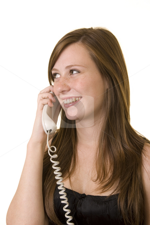 To use this stock image in your creative project, please select the size you need over to the right and click the "Add to Cart" button.
Your downloaded image will come with the Cutcaster watermark removed so don’t worry about the watermark you see on this page. Young lady on phone stock photo, Pretty young girl with cute freckles wearing a black top, talking on the phone and smiling. by Nicolaas Traut