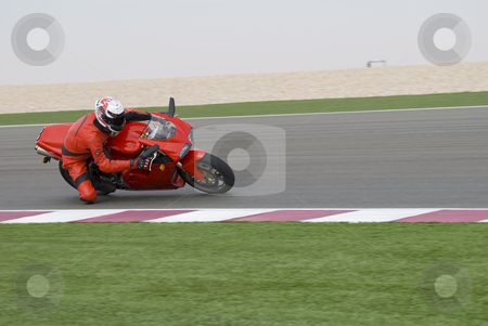 To use this stock image in your creative project, please select the size you need over to the right and click the "Add to Cart" button.
Your downloaded image will come with the Cutcaster watermark removed so don’t worry about the watermark you see on this page. Superbike racing on track stock photo, Superbike rider leaning into a corner at high speed, racing on a race track. by Nicolaas Traut
