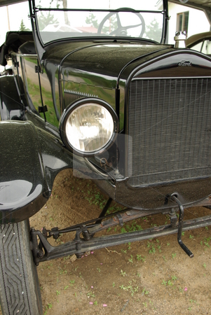 To use this stock image in your creative project, please select the size you need over to the right and click the "Add to Cart" button.
Your downloaded image will come with the Cutcaster watermark removed so don’t worry about the watermark you see on this page. Model T Ford - Tin Lizzie stock photo, This 1926 Model T Ford (also known as a Tin LIzzie) may be an antique auto but it has been restored and still runs. by Dennis Thomsen