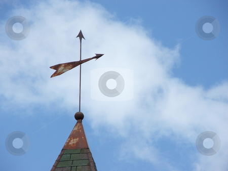 To use this stock image in your creative project, please select the size you need over to the right and click the "Add to Cart" button.
Your downloaded image will come with the Cutcaster watermark removed so don’t worry about the watermark you see on this page. Weathervane Points Direction stock photo, A primitive, old, metal weathervane attached to a lightning rod shows the winds direction on a partly sunny day in northeast Iowa. Today the weathervane can symbolize the seach for meaning in life and living. by Dennis Thomsen