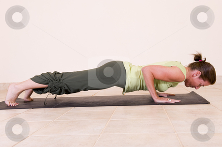 To use this stock image in your creative project, please select the size you need over to the right and click the "Add to Cart" button.
Your downloaded image will come with the Cutcaster watermark removed so don’t worry about the watermark you see on this page. Yoga four limbed staff pose stock photo, Beautiful young lady in the yoga 'Four limbed staff pose - Chaturanga Dandasana'. by Nicolaas Traut