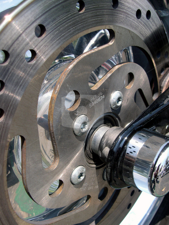 To use this stock image in your creative project, please select the size you need over to the right and click the "Add to Cart" button.
Your downloaded image will come with the Cutcaster watermark removed so don’t worry about the watermark you see on this page. Motorcycle brake rotor stock photo, Close up photo of a motorcycle brake rotor and axle by Rob Wright